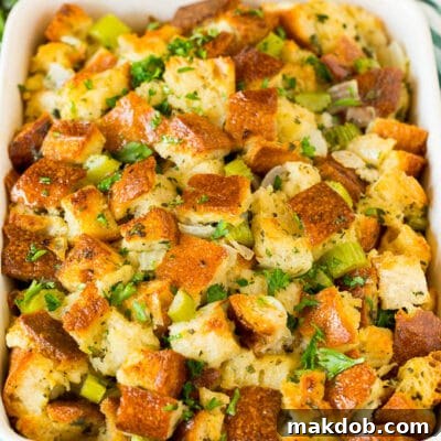 Thanksgiving stuffing in a baking dish, topped with parsley.