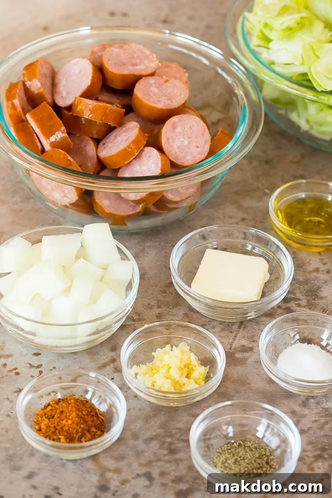 This cabbage and sausage skillet is a combination of smoked sausage, vegetables and savory seasonings, all cooked together to make a quick and easy dinner. Bowls of ingredients for the recipe.