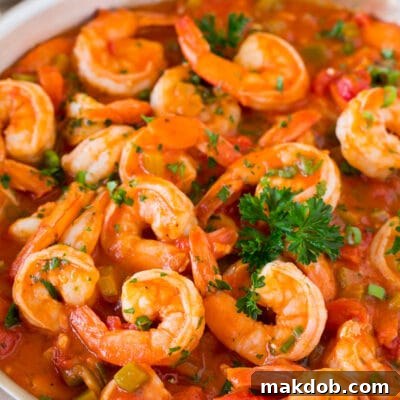 A pan of Shrimp Creole garnished with parsley.