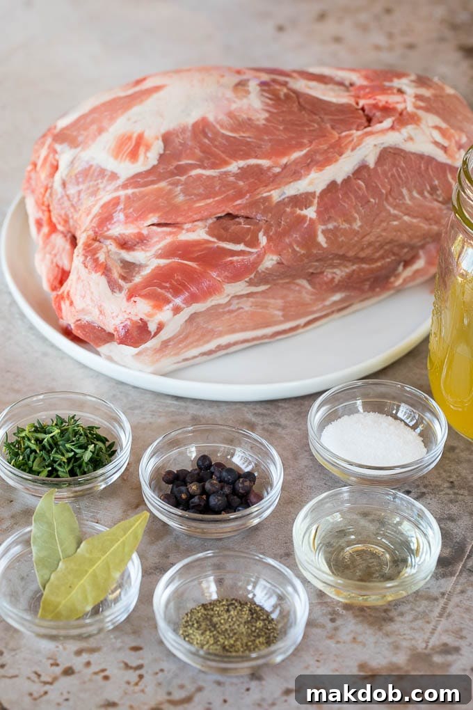 A pork roast and bowls of herbs and spices.