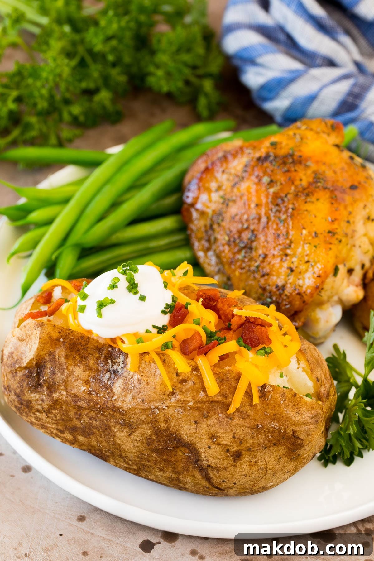 Perfectly Roasted Potatoes 6 An oven baked potato served with chicken and green beans.