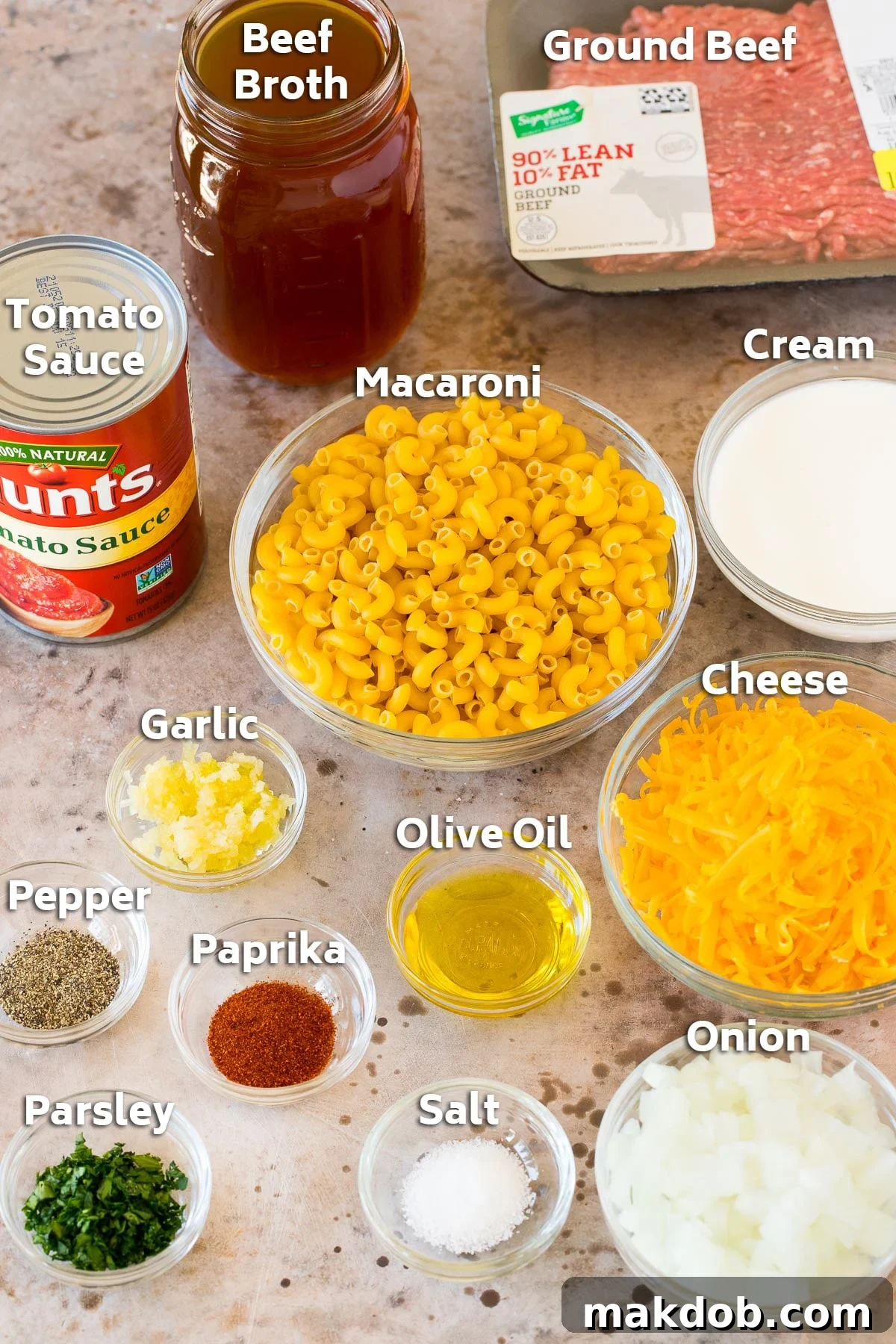 Better-Than-Box Hamburger Helper 3 Bowls of ingredients including macaroni, cheese, seasonings and a package of ground beef.