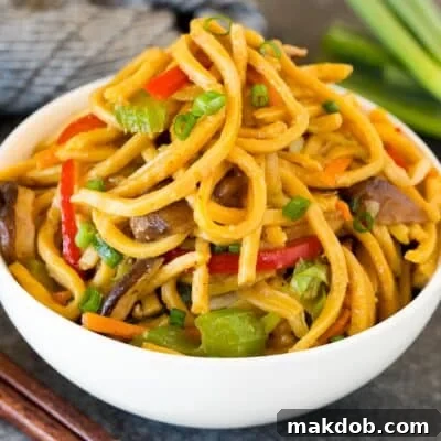 A serving bowl filled with vegetable lo mein.