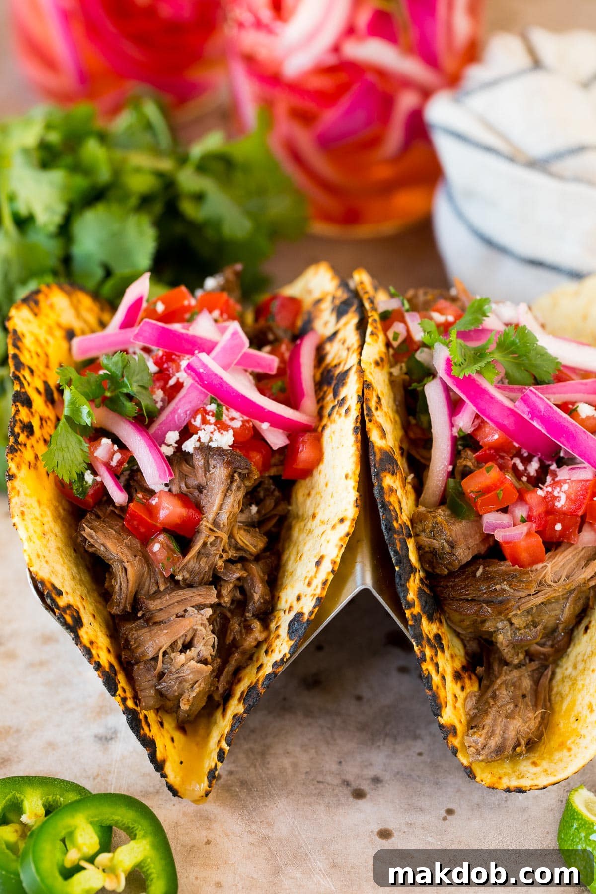 Ruby Red Pickled Onions 6 Tacos topped with pickled red onions.