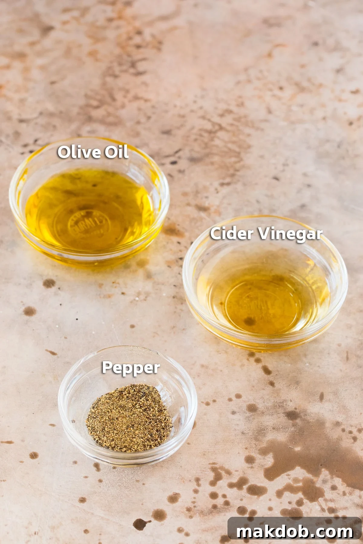 Bowls containing salad dressing ingredients.