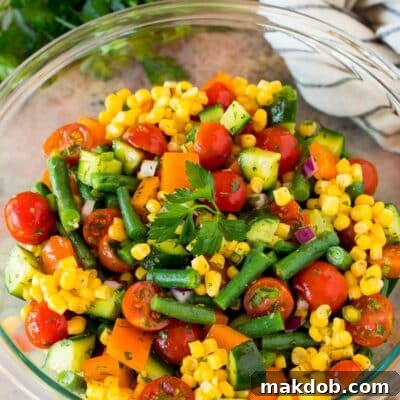 A bowl of freshly prepared chopped vegetable salad, ready to be served and enjoyed.