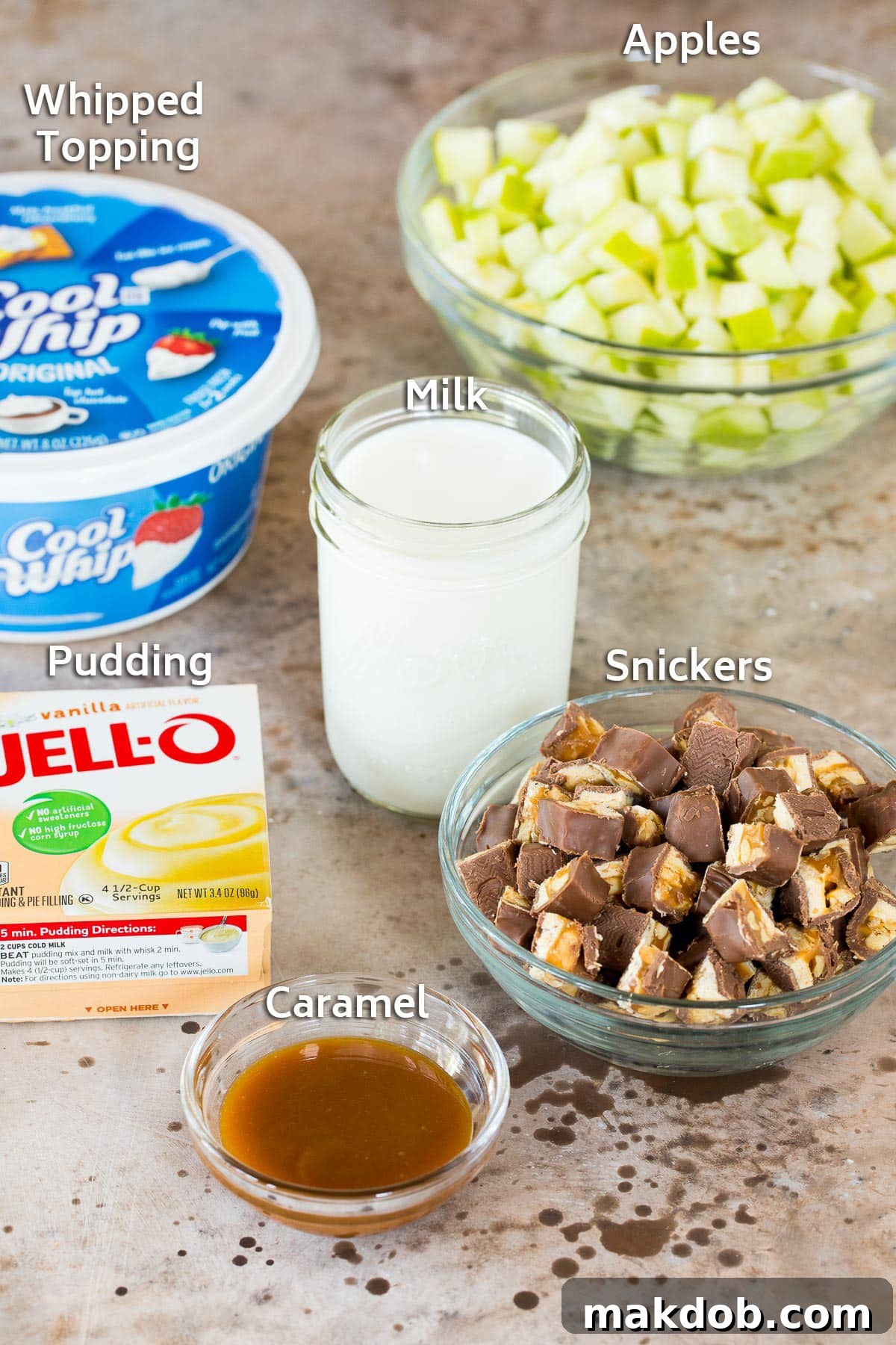 Snickers Apple Delight 3 Ingredients including apples, milk, pudding mix, candy bars and caramel.