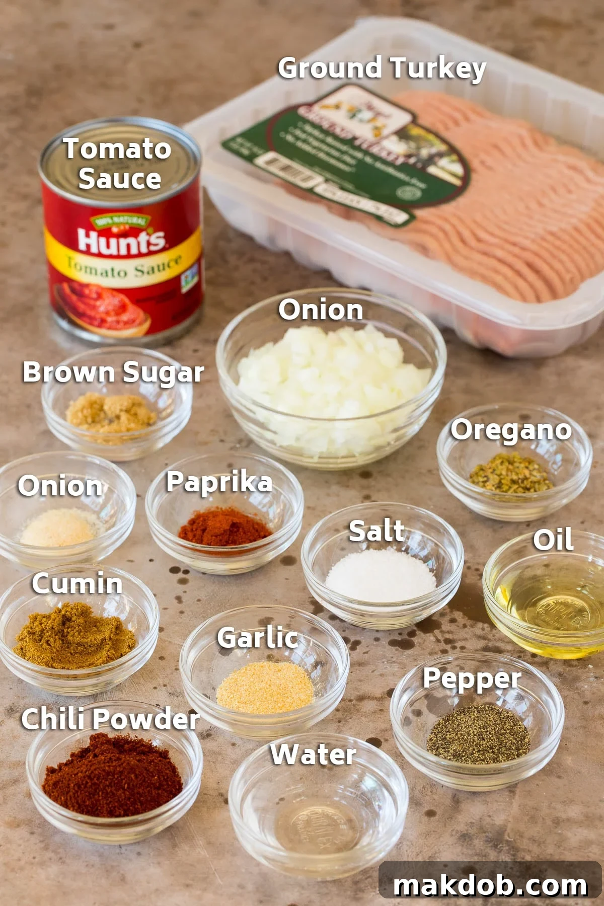 Effortless Turkey Tacos 3 Ingredients including ground turkey, onion, tomato sauce and assorted spices.
