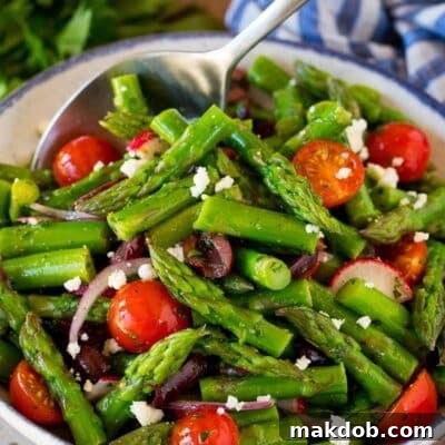 Spring Asparagus Salad 8 Asparagus salad with a serving spoon in it.