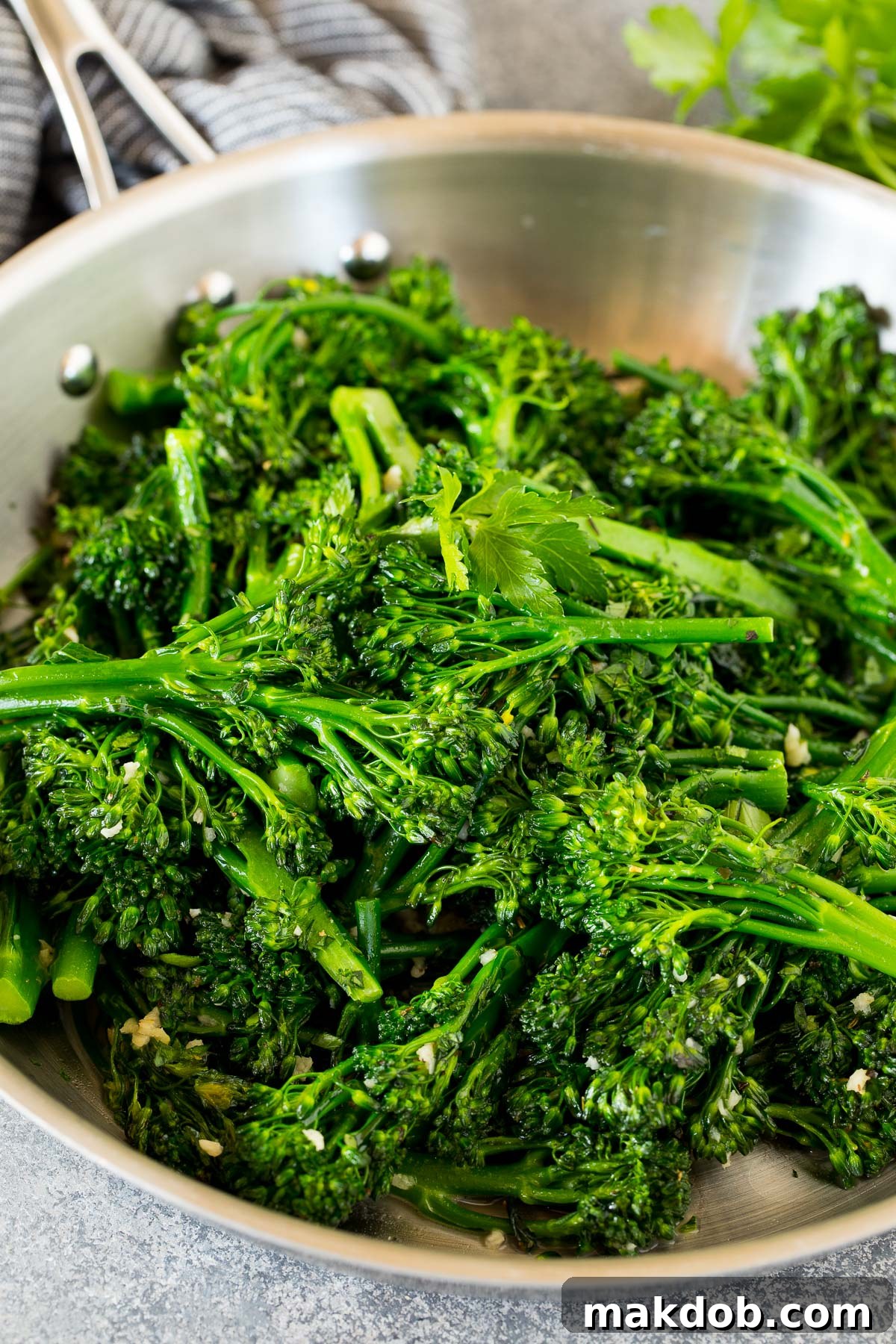 Flavorful Pan-Seared Broccolini 5 Sauteed broccolini in a pan, beautifully topped with fresh parsley.