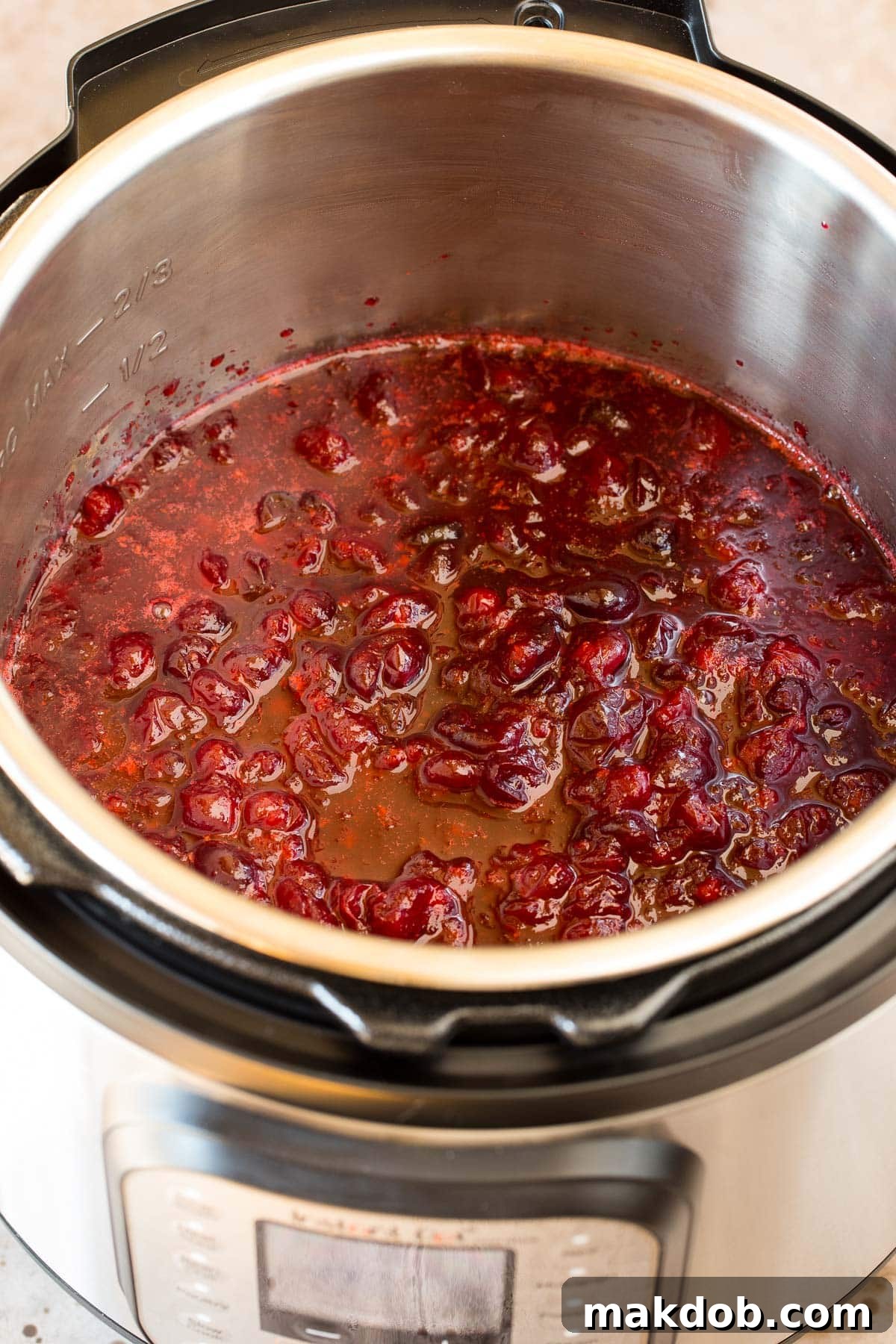 Instant Pot Cranberry Delight 5 Cranberry sauce inside of a pressure cooker.