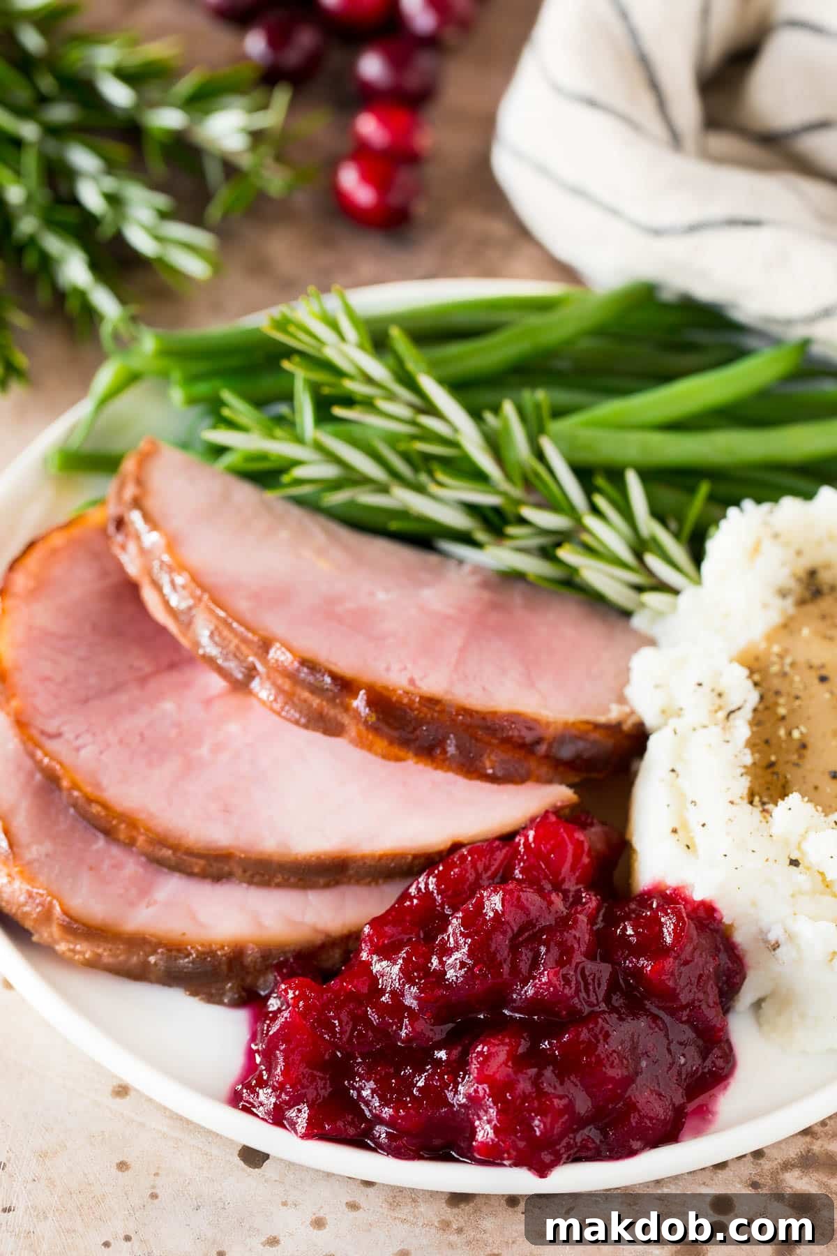 Instant Pot Cranberry Delight 6 Instant Pot cranberry sauce on a plate with ham and green beans.