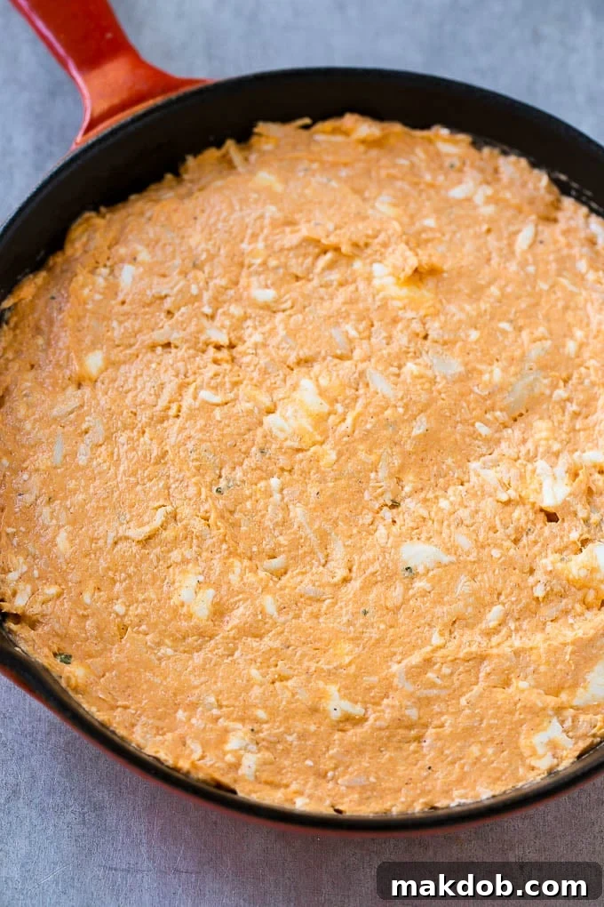 Buffalo Ranch Chicken Dip | Buffalo Chicken Dip | Baked Buffalo Dip | Cheesy Buffalo Dip #buffalowings #buffalochicken #dip #lowcarb #appetizer #dinneratthezoo The base layer of cream cheese, meat, ranch and hot sauce.