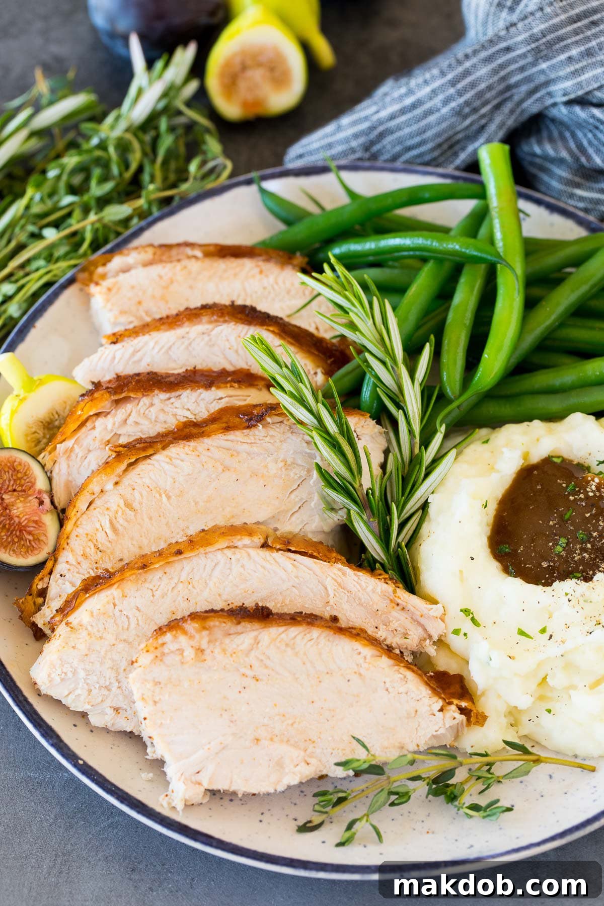 Spicy Cajun Turkey Feast 6 Perfectly sliced Cajun turkey arranged on a serving plate, accompanied by creamy mashed potatoes and vibrant green beans.