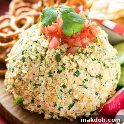 A square image of the Jalapeno Cheddar Cheese Ball with a serving suggestion.