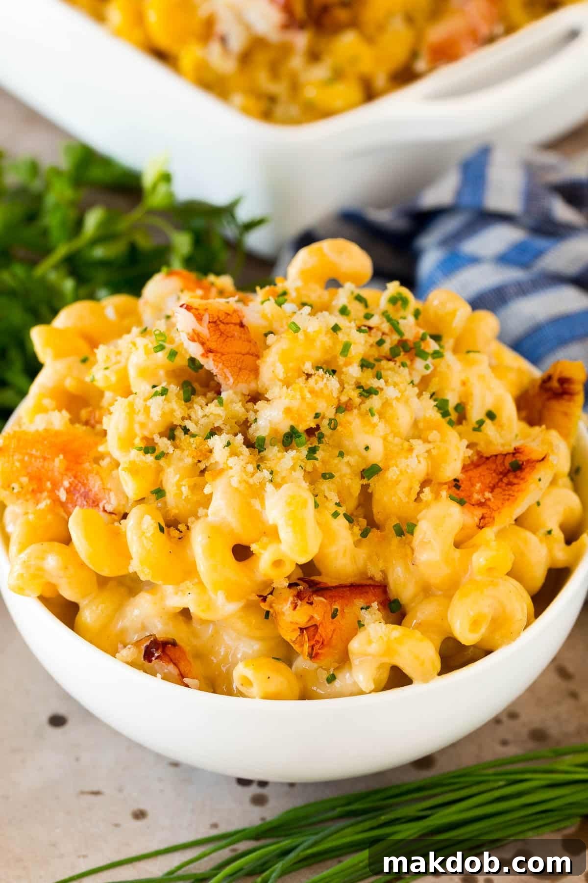 Decadent Crab Macaroni 2 A bowl of crab mac and cheese topped with herbs.