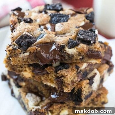 These Oreo cookies and cream bars are a chewy brown sugar blondie base loaded with white and dark chocolate and plenty of Oreo cookies. It's a quick and easy dessert that's sure to please any crowd.