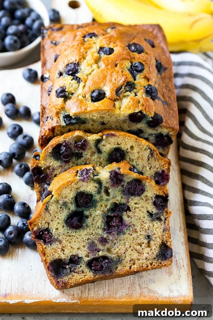 Blueberry Banana Bread | Easy Banana Bread | Homemade Banana Bread Recipe A loaf of sliced blueberry banana bread.