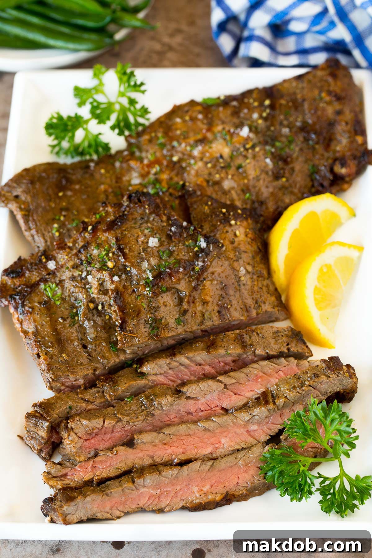 Next-Level Skirt Steak Marinade 6 Grilled and sliced skirt steak arranged beautifully on a platter, ready to be served.