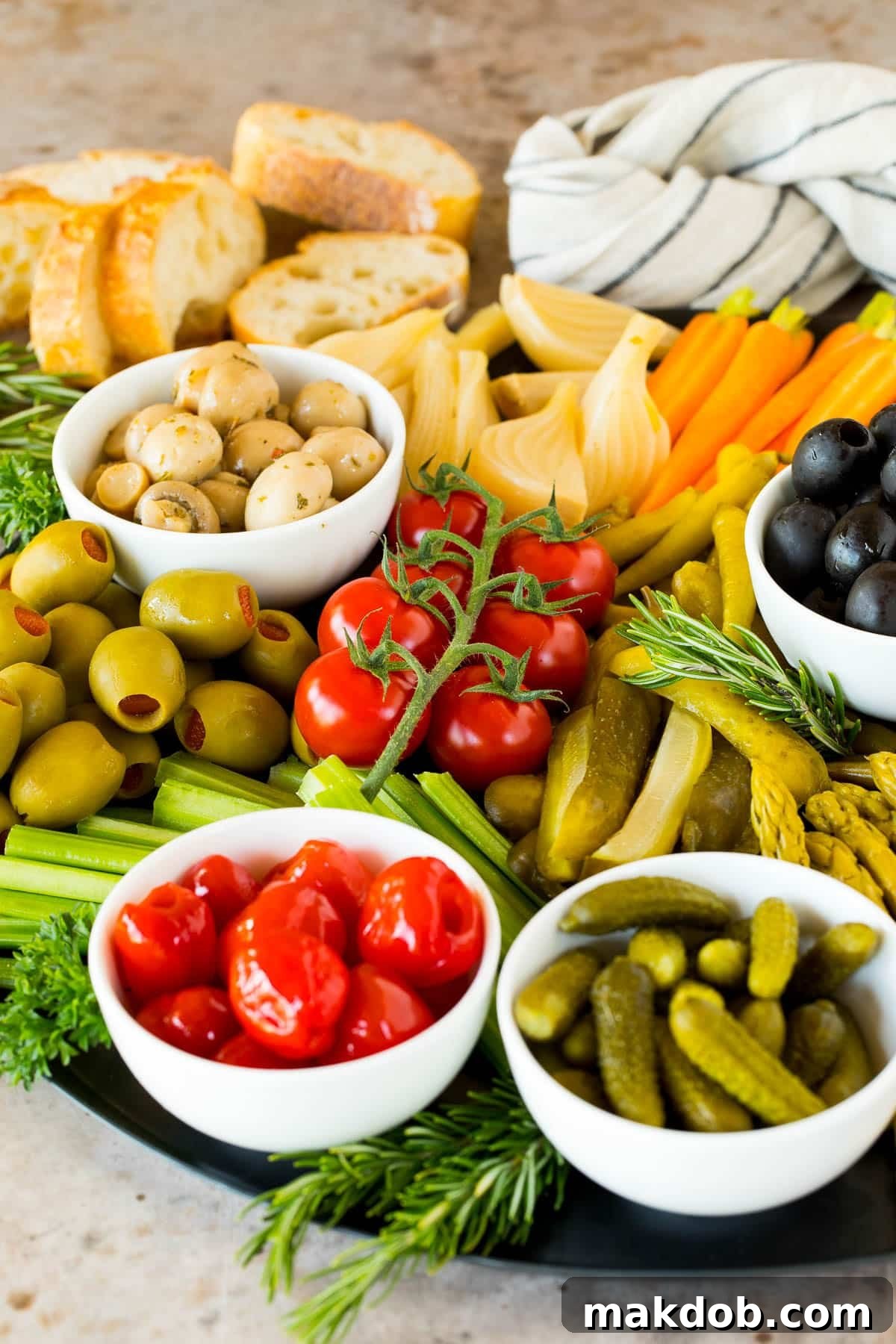 A close-up shot of a meticulously arranged relish tray, featuring an appetizing variety of pickles, briny olives, and vibrant pickled peppers.