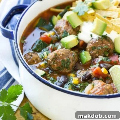 This recipe for mexican meatball soup is loaded with seasoned beef meatballs, black beans and plenty of vegetables in a flavorful and spicy broth. Add your favorite toppings and you've got a complete meal in a bowl!