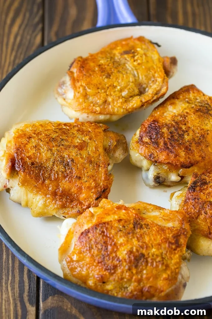 Chicken Cacciatore Recipe | Italian Chicken #chicken #peppers #mushrooms #olives #dinner #dinneratthezoo Golden-brown, seared chicken thighs ready to be braised in a hearty chicken cacciatore.