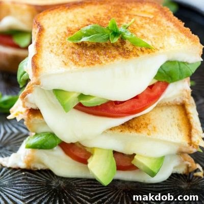This caprese sandwich recipe is the classic combination of tomatoes, mozzarella and basil with the welcome addition of avocado slices, all sandwiched together between slices of buttery toasted bread. ArtesanoBread AD
