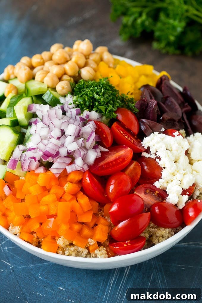 Cherry tomatoes, bell peppers, red onions, olives, feta and chickpeas over cooked quinoa.