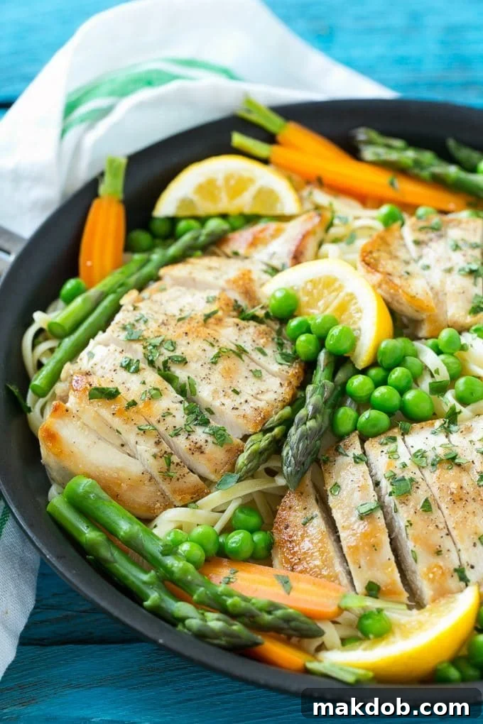 Chicken Primavera Recipe | Chicken Pasta | Vegetable Pasta #chicken #pasta #asparagus #carrots #peas #spring #dinner #dinneratthezoo Chicken primavera with sliced cooked chicken breast, fresh vegetables, and a rich butter sauce, garnished with parsley.