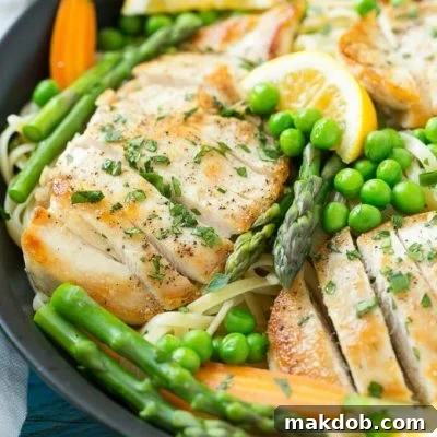 This recipe for chicken primavera is seared chicken breasts served atop a lemon butter pasta with plenty of fresh vegetables. A spring time dinner that's fit for any occasion!