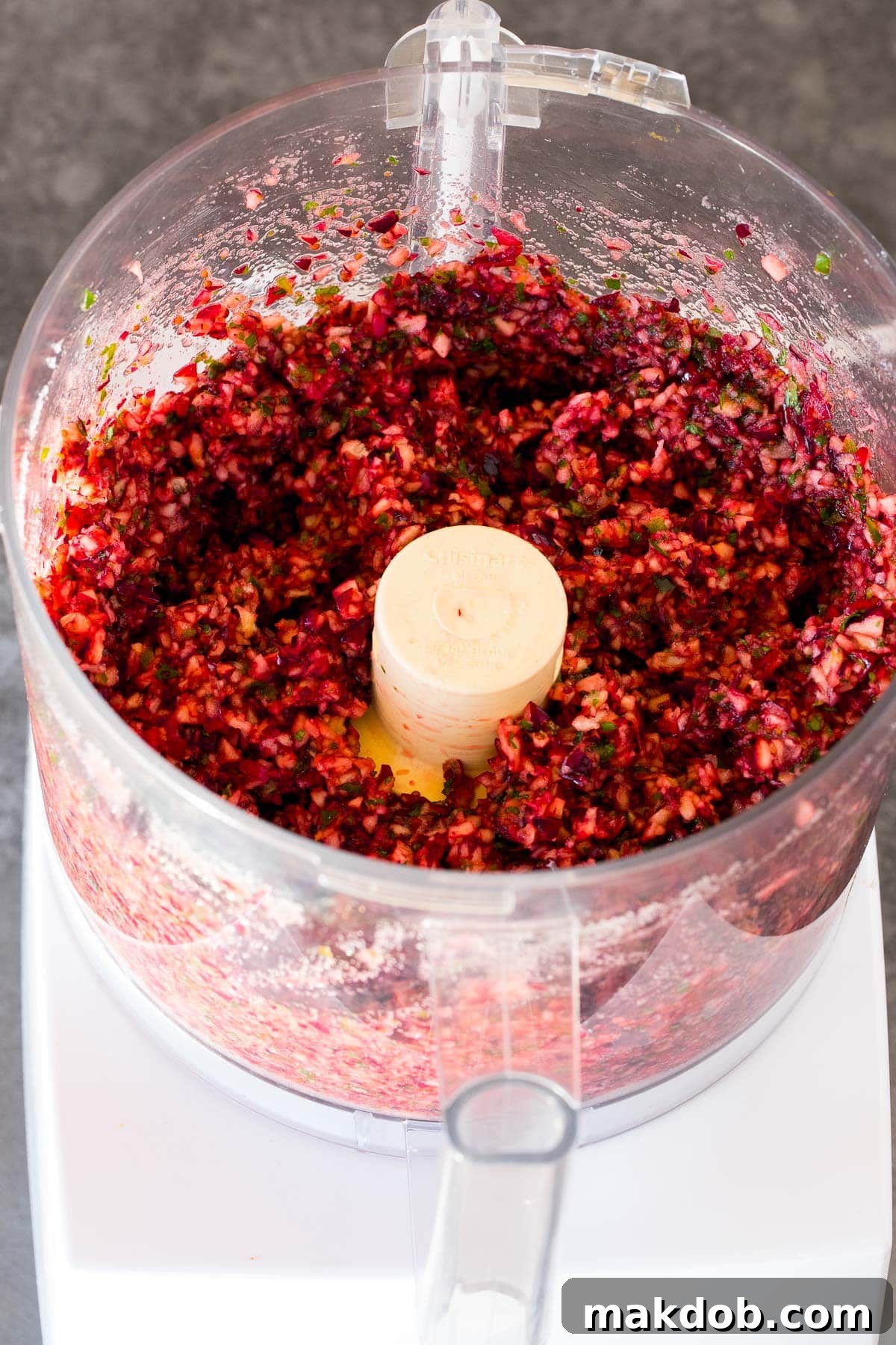 Cranberries, herbs and sugar ground together in a food processor.
