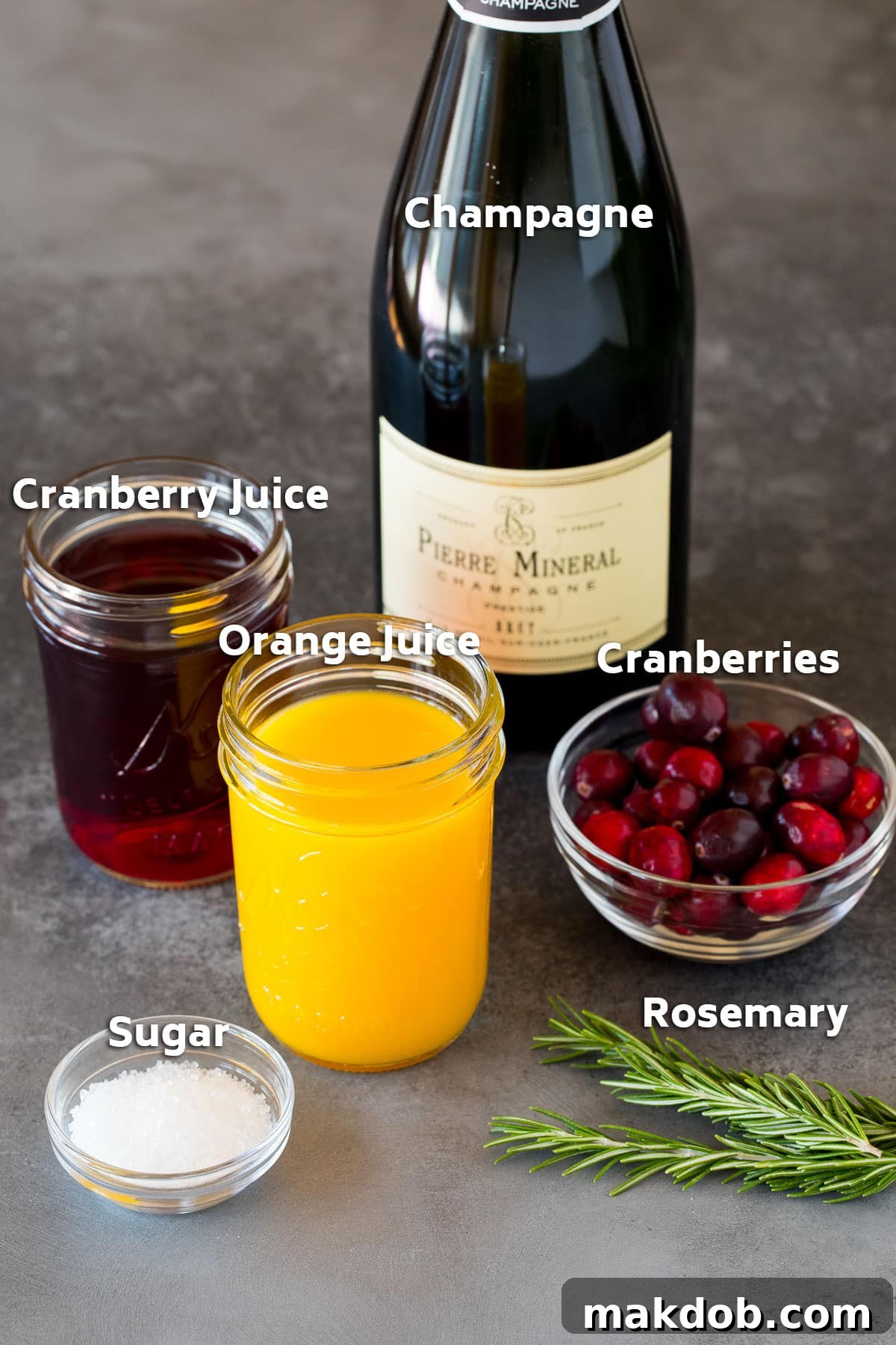 Ruby Fizz 3 Ingredients including champagne, cranberries, fruit juices and sugar.