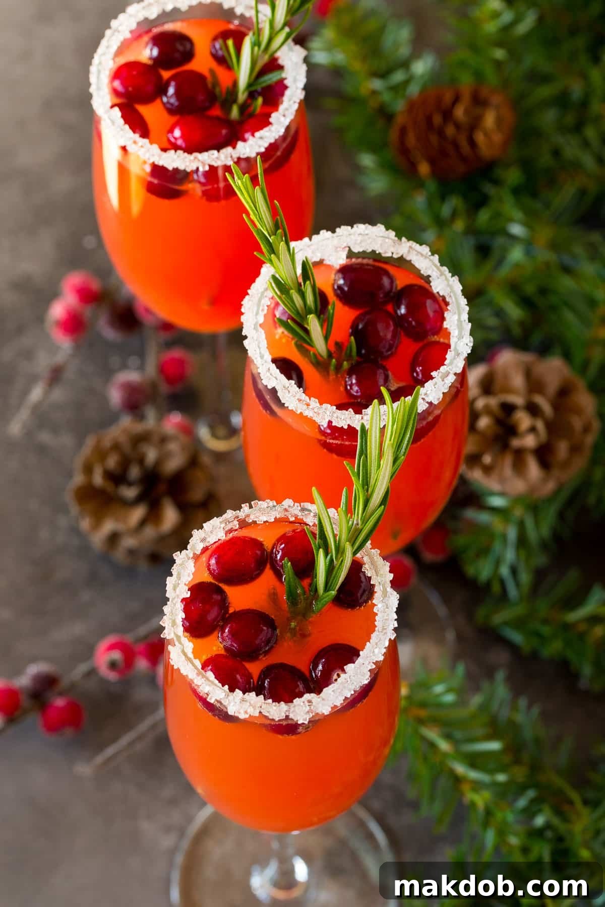 Ruby Fizz 6 Cranberry cocktails in champagne flutes.