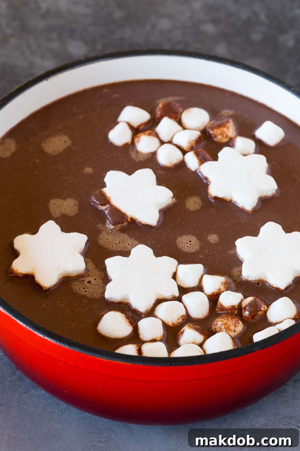 Peppermint Cocoa Bliss 5 A pot of peppermint hot cocoa with marshmallows floating in it.