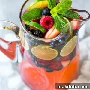 This berry champagne punch recipe is festive, refreshing and super easy to make! It's the perfect cocktail for any summer party.