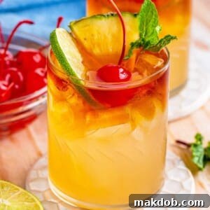 A picture of a classic Mai Tai cocktail, garnished with a pineapple wedge and a cherry, served in a tiki-style glass.