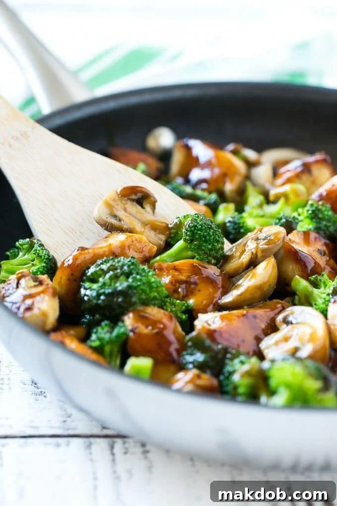 Chicken and Broccoli Stir Fry Recipe | Chicken Stir Fry | Healthy Chicken Recipe | Chicken and Broccoli | Chinese Food A pan of chicken and broccoli stir fry with a spatula in it.