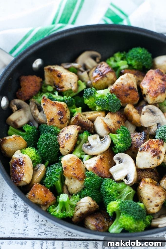 Chicken and Broccoli Stir Fry Recipe | Chicken Stir Fry | Healthy Chicken Recipe | Chicken and Broccoli | Chinese Food Sauteed chicken pieces, broccoli florets and mushrooms in a pan.