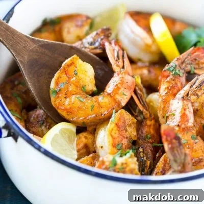 This recipe for New Orleans BBQ shrimp is tender and succulent shrimp cooked in a bold and zesty sauce - full of flavor and easy to make!