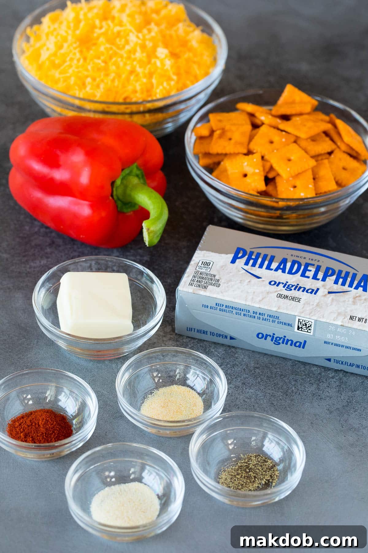 Pumpkin Spice Cheeseball 3 Ingredients including cream cheese, cheddar cheese, spices and cheese crackers.