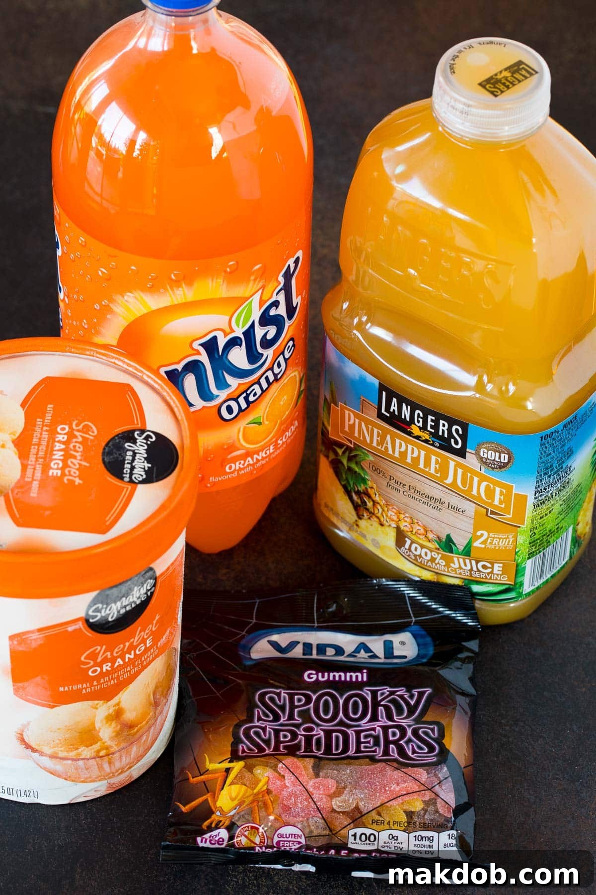 Enchanted Concoction 3 Orange sherbet, orange soda, pineapple juice and gummy spiders.