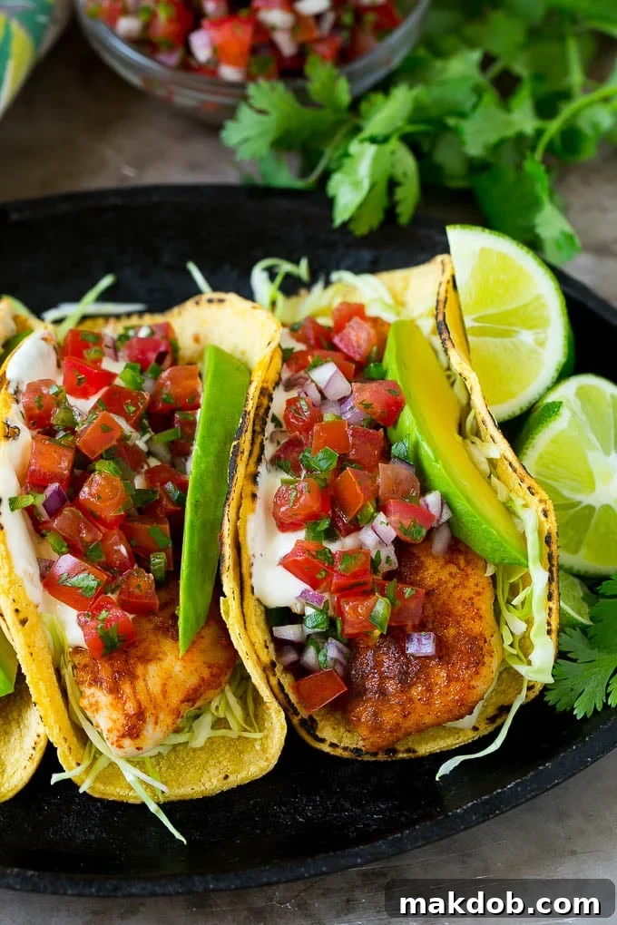 Fish Tacos Recipe | Tilapia Fish Tacos #tacos #fish #tacotuesdady #avocado #dinner #dinneratthezoo Fish tacos wrapped in corn tortillas with sliced avocado and pico de gallo.
