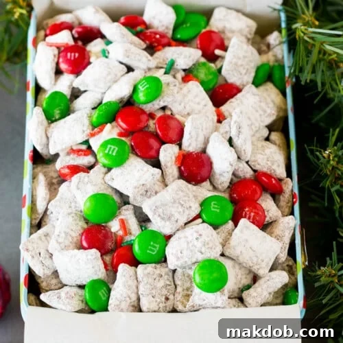 A holiday tin filled with Christmas puppy chow mix.