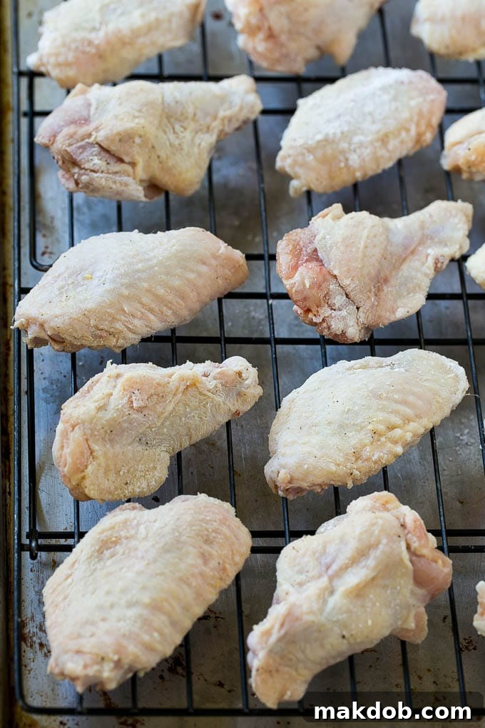 Chicken wings on a baking rack.