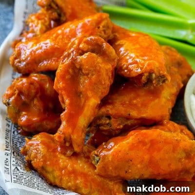 Baked buffalo wings tossed in hot sauce, served with celery sticks.