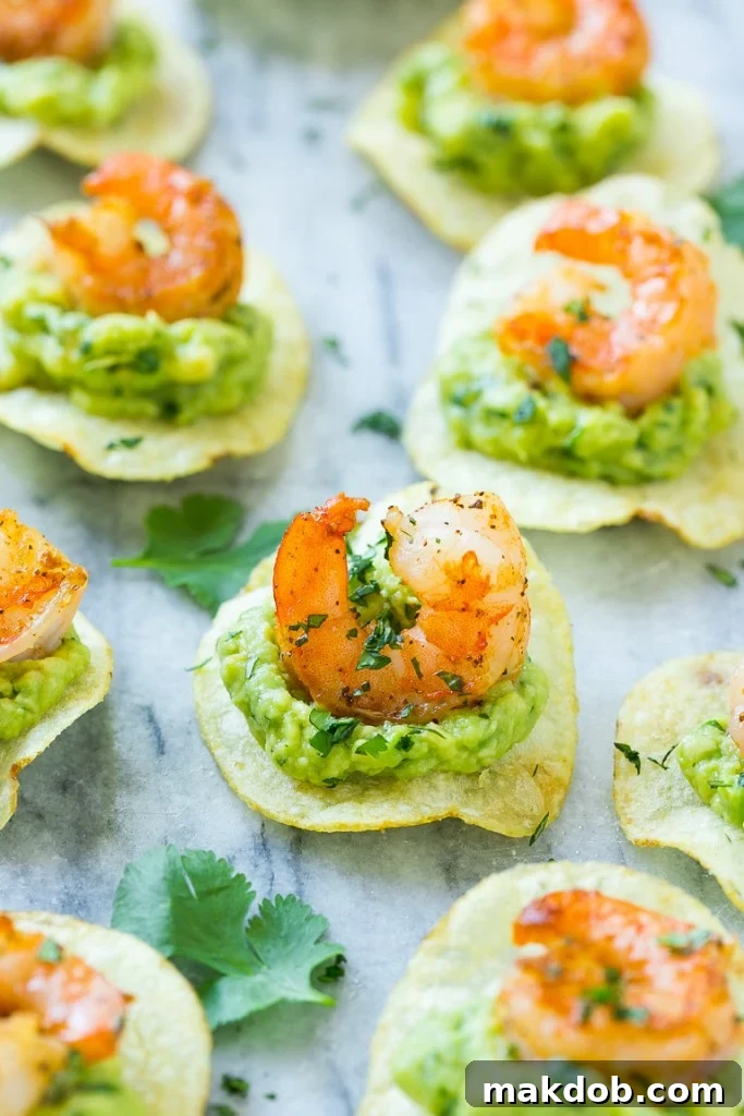 Mexican shrimp bites garnished with vibrant fresh cilantro, adding a touch of color and herbaceous flavor.