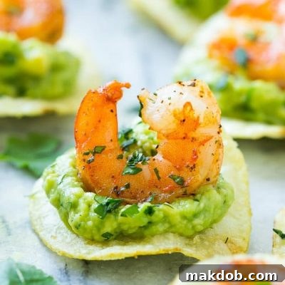 Seared shrimp and guacamole layered onto individual potato chips – an easy and elegant appetizer.