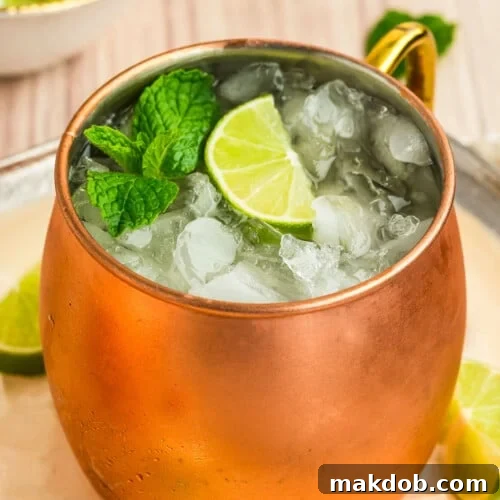 Refreshing Irish Mule 7 An Irish mule drink in a copper mug topped with a lime and mint sprig.