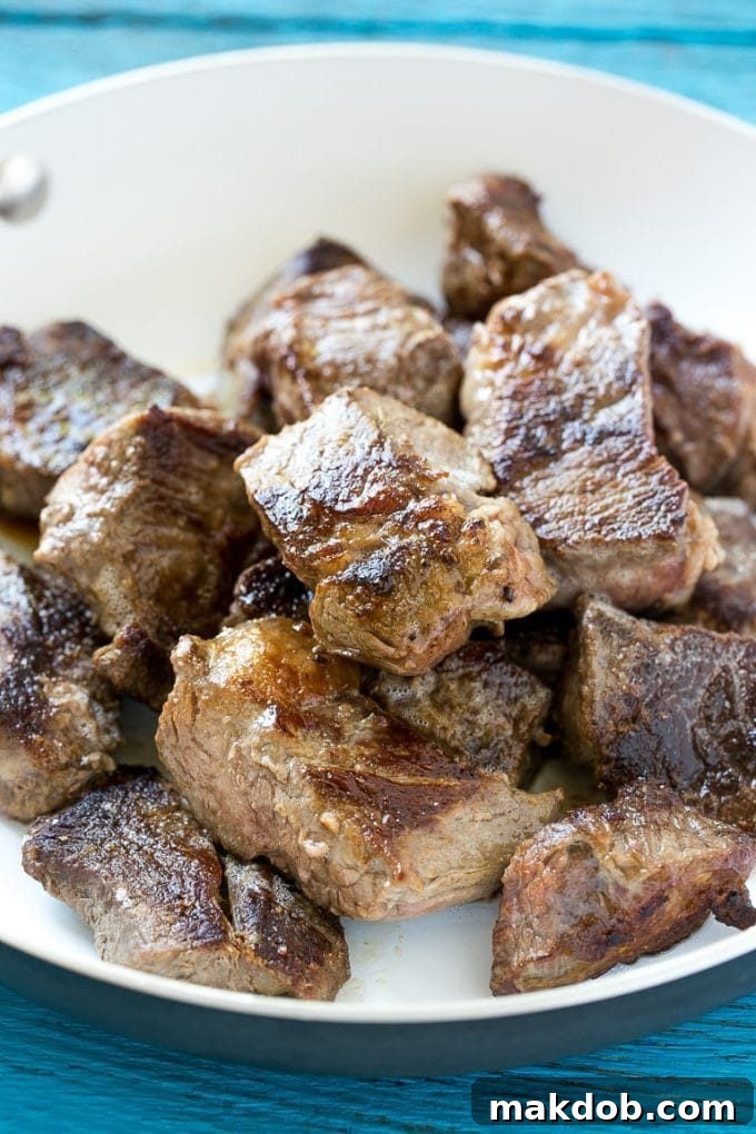 Searing Beef for Maximum Flavor in Your Chile Colorado Seared beef cubes in a pan, ready for slow cooking in Chile Colorado sauce.