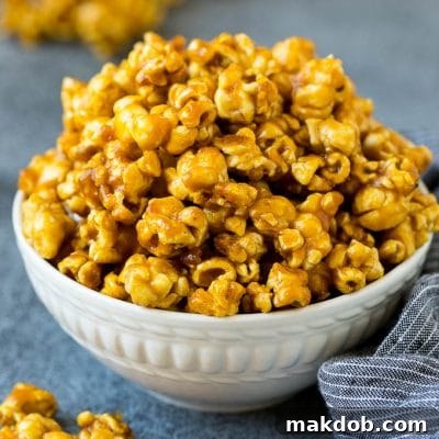 A serving bowl filled with caramel popcorn.